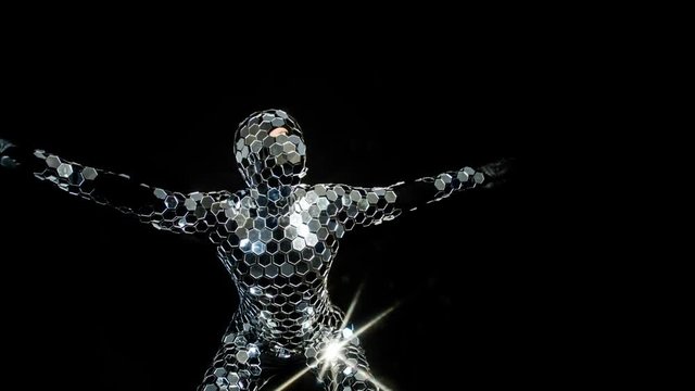 person dancing in amazing discoball mirror suit