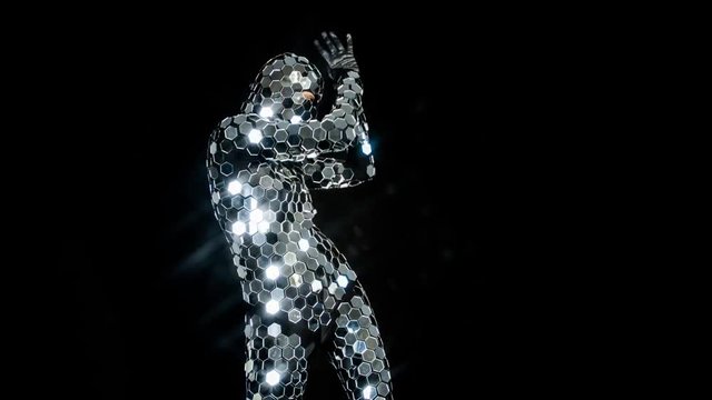 person dancing in amazing discoball mirror suit