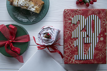 New year and winter set on white wooden background with red and green and white details, striped golden and white 2017 