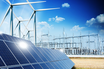 Modern electric grid lines and renewable energy concept with photovoltaic panels and wind turbines - 131872217