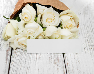 White roses with tag
