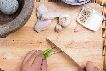 Fototapeta na wymiar Chef cutting coriander with knife