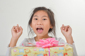 Cute Asian girl with gift on a white background