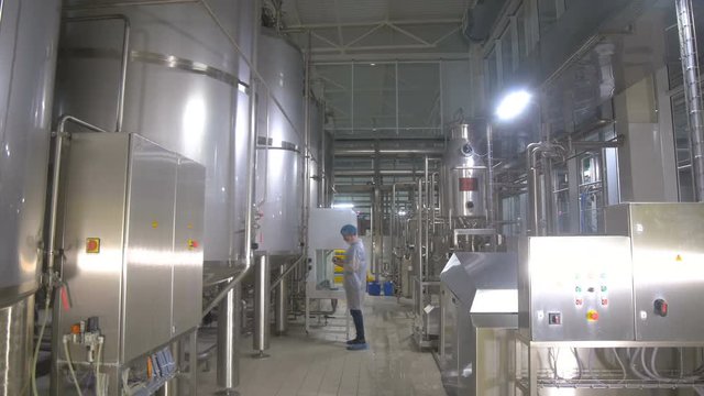 Production tanks, storages at a brewery. Pipline at a brewery factory. 4K.