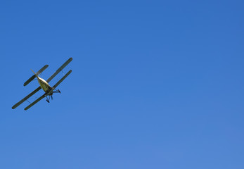The spraying of fertilizers and pesticides on the field with the aircraft.