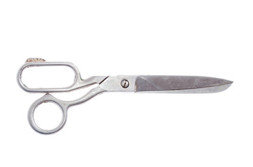 big metal scissors for cutting fabric on a white background