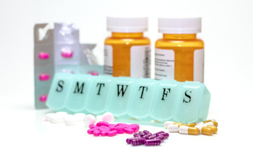 Pill box , Pill Bottles, Sleeve, and Assorted Pills.