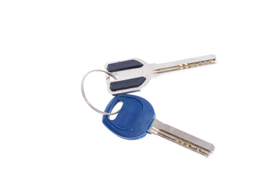 keys from a door lock on a white background