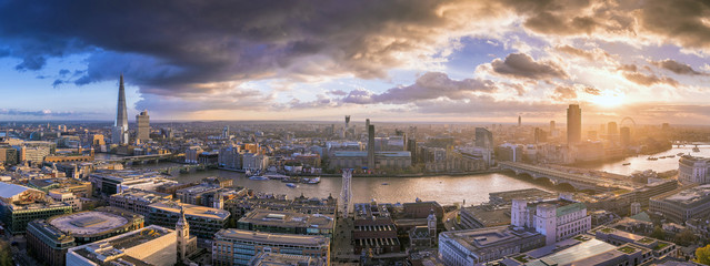London, England - Panoramic skyline view of south London at sunset with famous skyscrapers and dark clouds over the city - obrazy, fototapety, plakaty