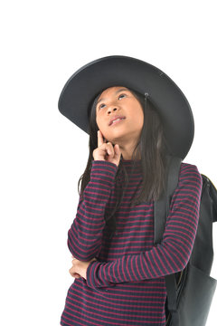 Asian girl in a cowboy hat looking up isolated on white backgrou