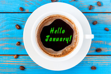 Hello January - text on morning coffee mug. Top view, New year hangover concept. Happy first month of the year - Powered by Adobe