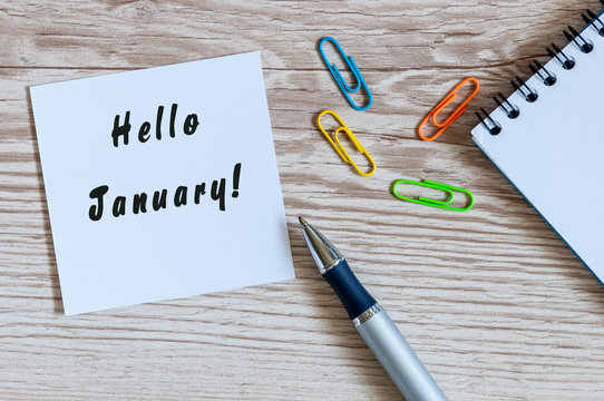 Hello January greeting on paper at home or office workplace, New year beginning concept. business background