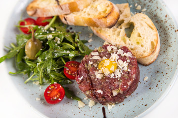 appetizer of veal on white