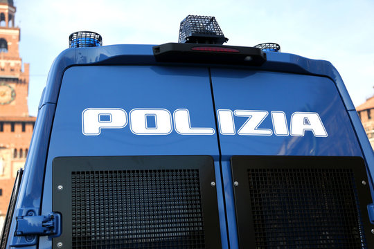 armored police van in front of the Castello Sforzesco in Milan t