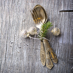 Vintage old cupronickel cutlery With Christmas  garland of silver balls , horizontal