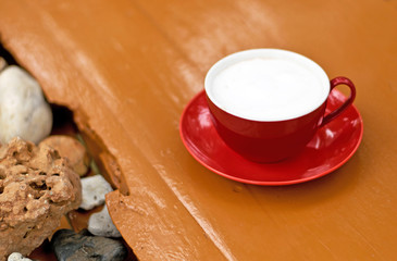 Red cup of coffee for background.