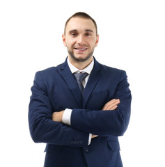 Young business coach with crossed hands standing on white background