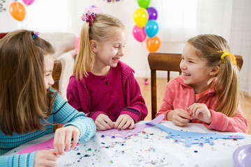 Birthday: Girls Sitting At Table Doing Crafts