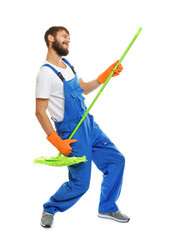 Funny young man with green mop on white background