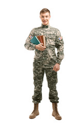 Soldier in camouflage holding books, on white background