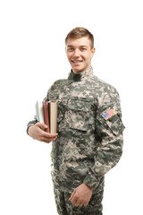 Soldier in camouflage holding books, on white background
