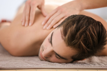 Obraz na płótnie Canvas Man having massage in spa salon