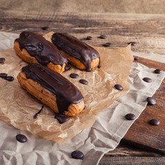 Eclairs or Profiterole with Dark Chocolate. Cooking