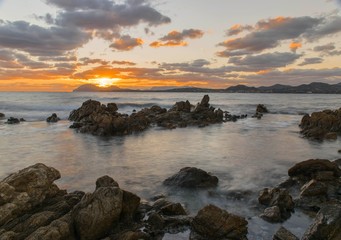 Fototapeta na wymiar Sunrise with clouds in Costa Smeralda