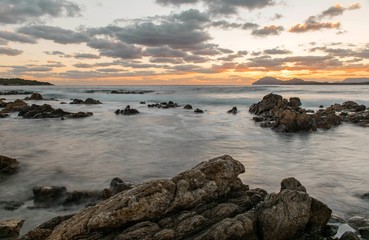 Fototapeta na wymiar Sunrise with clouds in Costa Smeralda