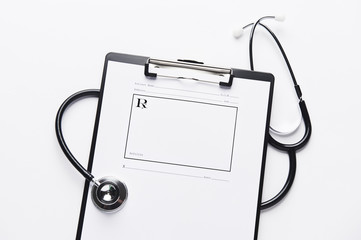 Blank prescription pad, with stethoscope and clipboard.