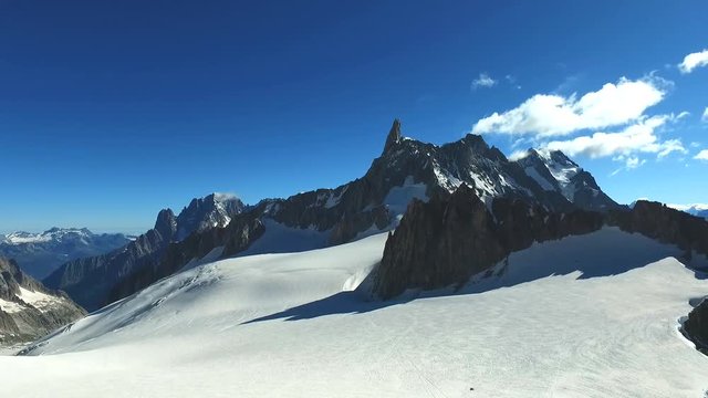 Panoramic view of Western alps whith Mount Blanc and Giant's Tooth (Dent du Geant) from Helbronner roof of europe in Aosta Valley region of Italy