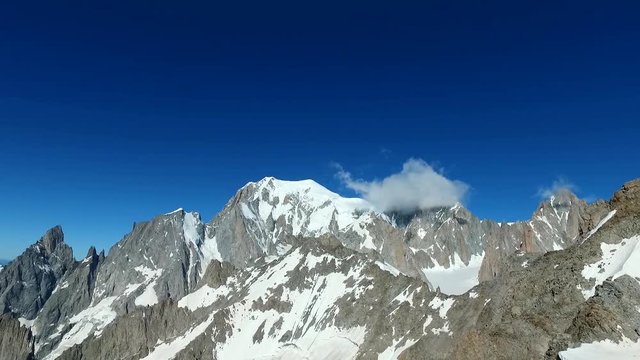 Panoramic view of Western alps whith Mount Blanc and Giant's Tooth (Dent du Geant) from Helbronner roof of europe in Aosta Valley region of Italy