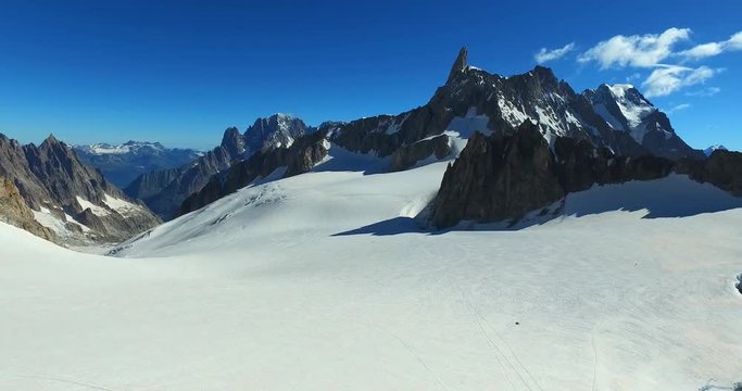 Panoramic view of Western alps whith Mount Blanc and Giant's Tooth (Dent du Geant) from Helbronner roof of europe in Aosta Valley region of Italy