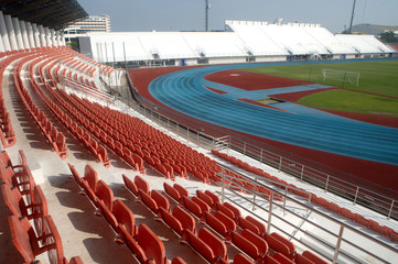 Fototapeta premium Colorful of stadium seats in background.