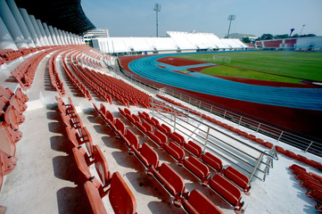 Fototapeta premium Colorful of stadium seats in background.