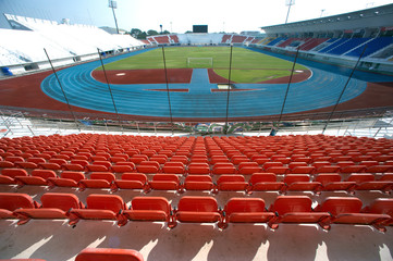 Naklejka premium Colorful of stadium seats in background.