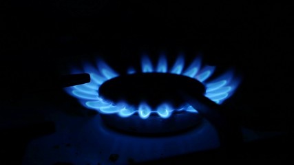 Domestic gas stove is lit blue gas video