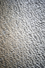 Ripples cast into wet sand to give a textured pattern