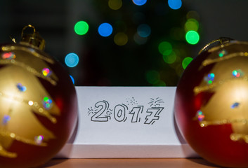 2017 written on paper with bokeh background