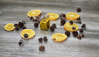 Small golden present with decorative cones