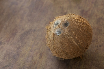 peeled ripe coconut on the wooden table