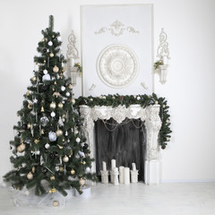 Christmas tree decorates with artificial flowers, garlands and C