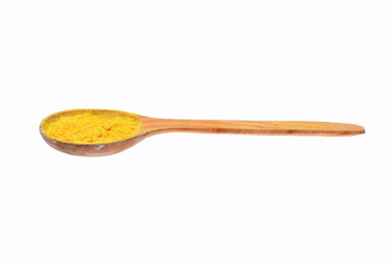 colorful turmeric in wooden spoon