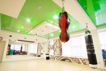 Interior of a fitness hall with punching bags