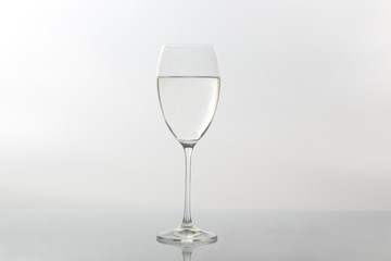 wine glass of water on light background