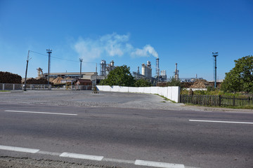 Wood factory with smoking chimneys