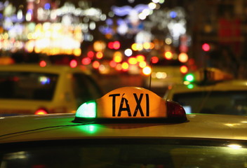 Taxi at night with lights signal system works.