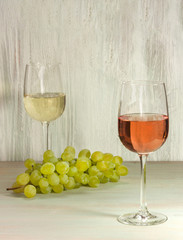 Rose and white wine with grapes