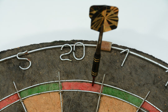 Dart hitting double 20 on dart board to start cricket game or 301 game