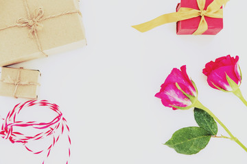 Valentines Day preparation gift, gift box with roses on white table, with copy space
